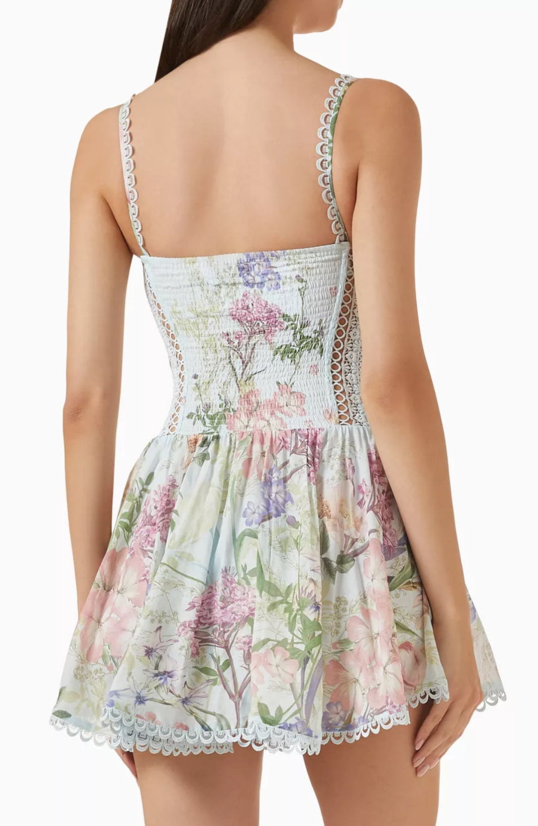 Back view of a floral dress with lace trim on a white background