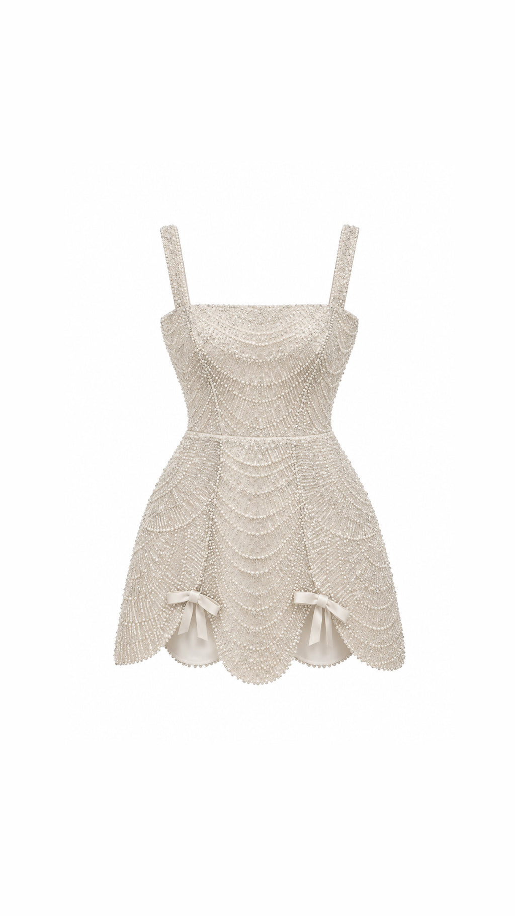 An off-white textured lace dress with a sweetheart neckline, thin shoulder straps, a fitted bodice, and a flared skirt with scalloped edges and small bow details at the hips, shown against a plain white background.